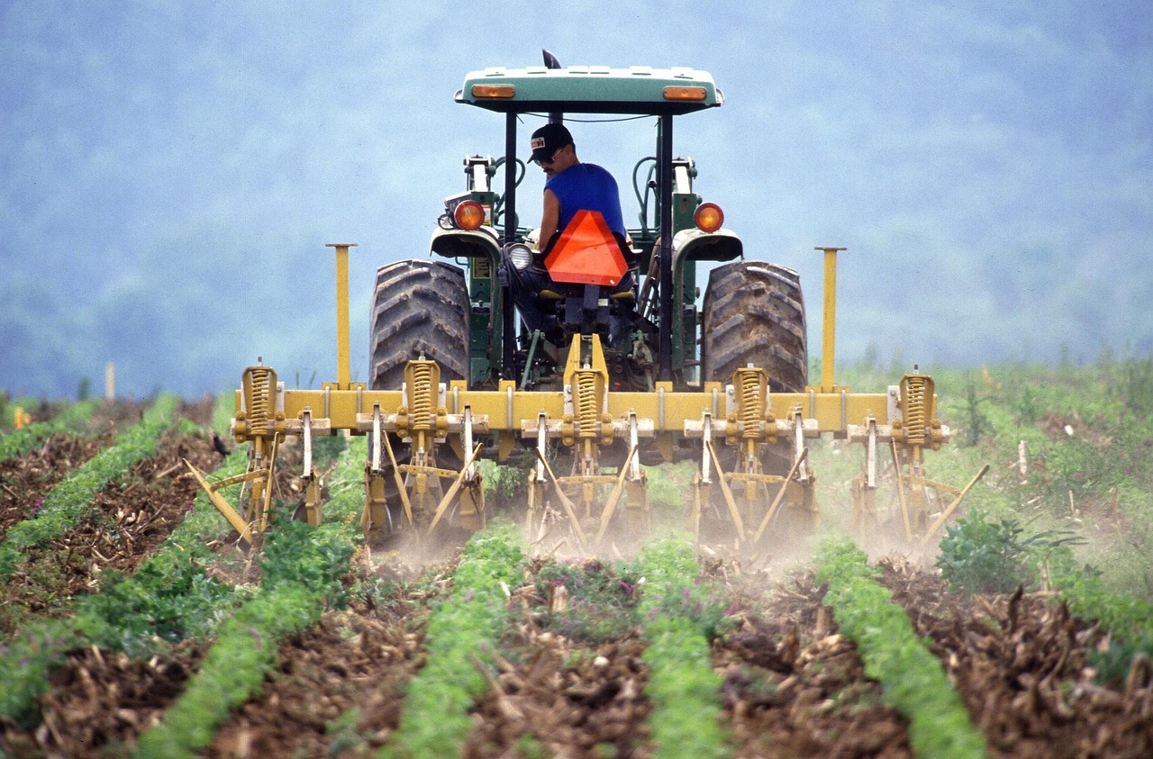 Tractor sprays fertilizer on a field