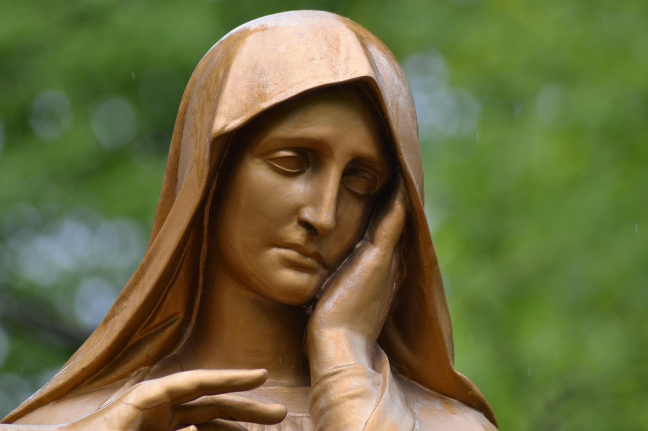 Bronze statue of Mary crying