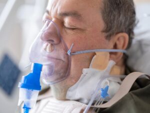 Hospital patient wearing a breathing mask